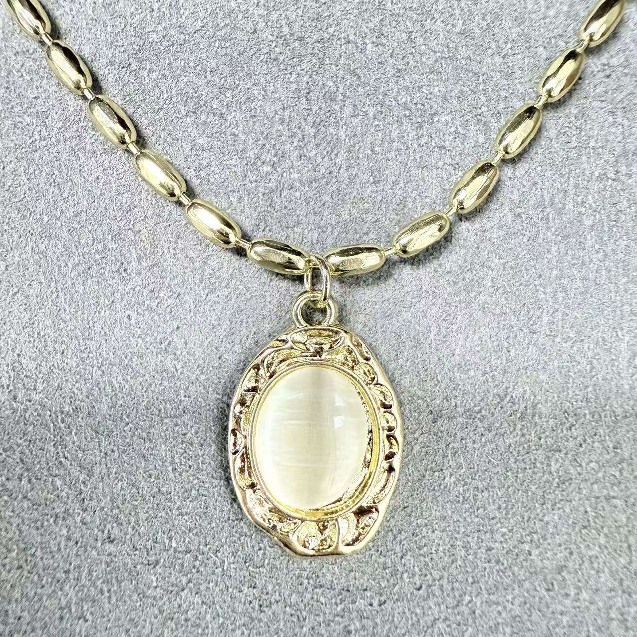 Ruby oval pendant necklace on a crimson luxury background