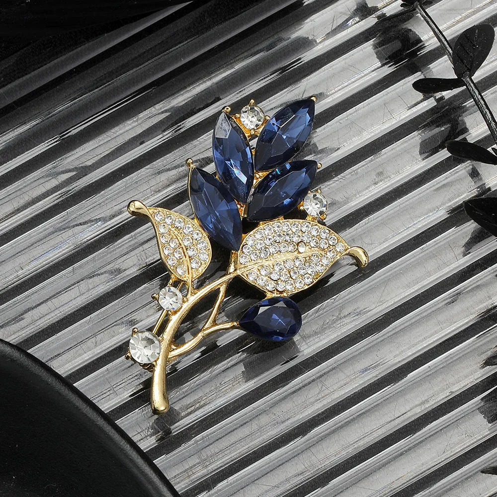 Luxury Gold Plated Zinc Alloy Blue Crystal Leaf Brooch Pins with Rhinestone for Women's High-End Fashion Accessories