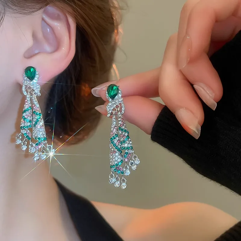 Luxurious Emerald Green Crystal Tassel Drop Earrings Sparkling Rhinestone Embedded Peacock Inspired Design Shiny Silver Plated view 3