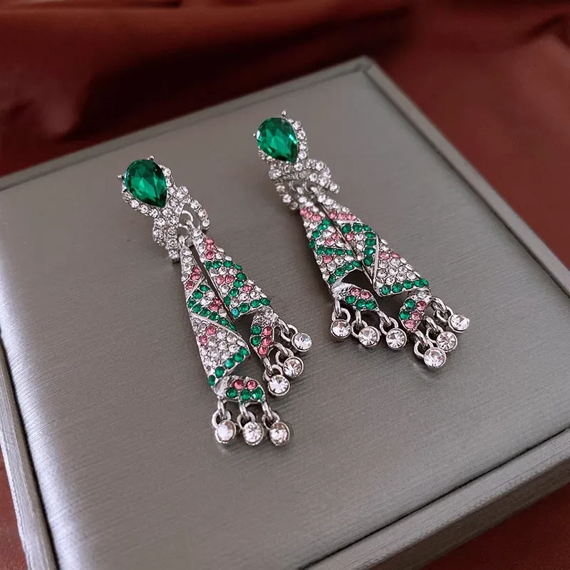 Luxurious Emerald Green Crystal Tassel Drop Earrings Sparkling Rhinestone Embedded Peacock Inspired Design Shiny Silver Plated